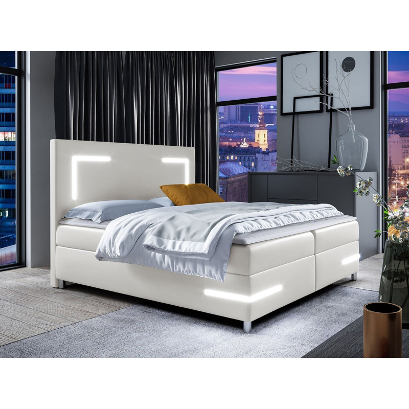 Boxspring ágy 120x200 MADENA - fehér műbőr + fedőlap és LED világítás INGYENES